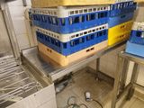 many crates stacked on top of each other in the kitchen