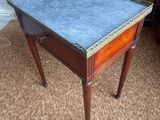 a small table with a marble top on it