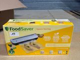 a box of food sitting on the floor next to a box of food