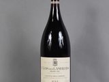 a bottle of wine that is sitting on a table