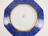 a plate with a blue and white design on it