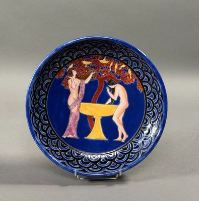 a blue plate with a picture of two women on it