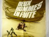 L'affiche du film « Le Jour du chasseur » représente un hélicoptère et un homme armé.
