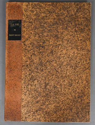 a book with a brown cover sitting on top of a table
