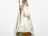 an image of a statue of the virgin of guadalupe on a pedestal