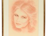 l'image d'un dessin d'un visage de femme dans un cadre doré