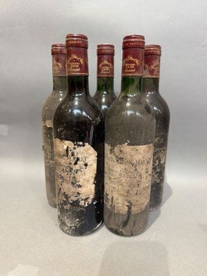three bottles of wine sitting next to each other on a table
