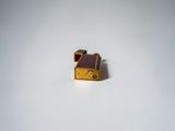 a small piece of luggage sitting on a white surface