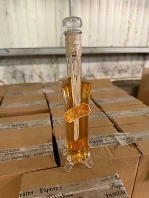 a glass bottle with a flower inside of it