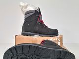 men ' s hiking boots in a box on a white surface