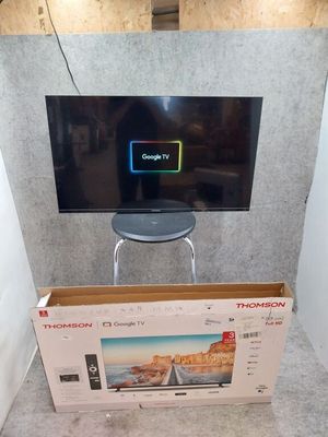 a television that is sitting in a box on the floor