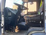 a dog that is sitting in the back of a truck