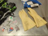 a table with gloves, gloves, gloves, and other items on it