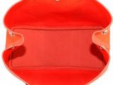the inside of a red purse with two handles