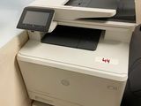 a printer that is sitting on top of a cabinet
