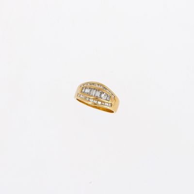 a close up of a gold ring with diamonds on a white background