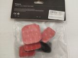 a package of pink guitar picks in a plastic bag