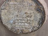 a metal plate that has some writing on it