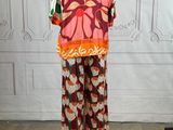 an image of a mannequin wearing a colorful shirt and pants