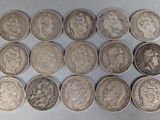 six different types of silver coins on a white surface