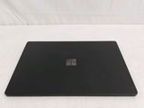 microsoft surface laptop on a white surface with a white background