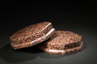 two cookies sitting on top of each other on a table