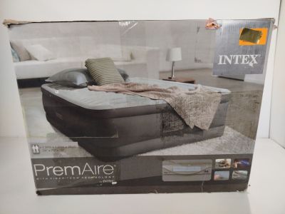 Coffret contenant un matelas gonflable avec des oreillers et des coussins