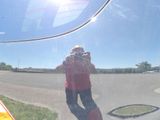 a man taking a picture of himself in the reflection of a car mirror