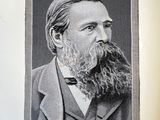 an old photo of a man with a long beard and a bow tie