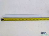 a ruler that is next to a piece of paper on a table