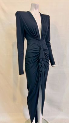 the dress is black and has long sleeves and a v - neck
