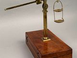 a wooden box with a scale on it and a wooden box with a scale on it
