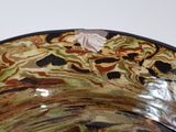 a close up of a decorative bowl on a table