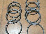 many different types of hose clamps laid out on the floor