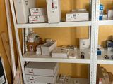 many boxes and boxes on the shelves in the room