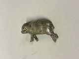 an image of a small silver animal on a white surface