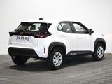 a white toyota rav parked in a room with a checkered floor