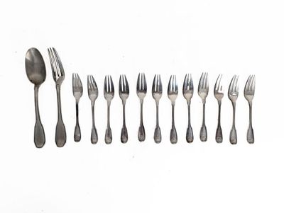 a lot of forks and spoons on a white surface