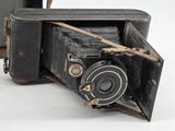 an old camera that is sitting on a table