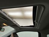 a view of the sunroof from inside of a car