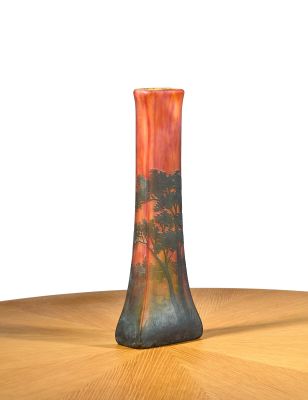 a vase that is sitting on a table with a white background