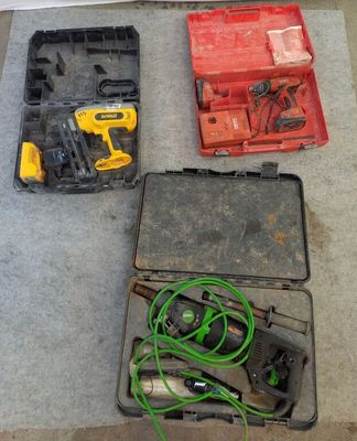 several tools are sitting in a case on the floor next to each other