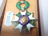 a medal with a star on it in a case