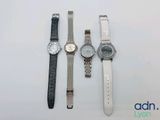 Trois montres sont alignées sur une table avec un fond blanc