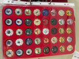 a picture of a red suitcase with a lot of coins on it