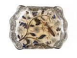 an image of a decorative plate with a bird on it