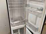 an open refrigerator that is sitting in a room
