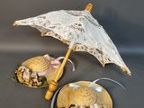 two seashells and an umbrella on a table