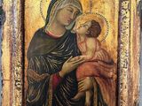 an old painting of a woman holding a child in her arms