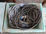 a bunch of wires in a basket on the floor